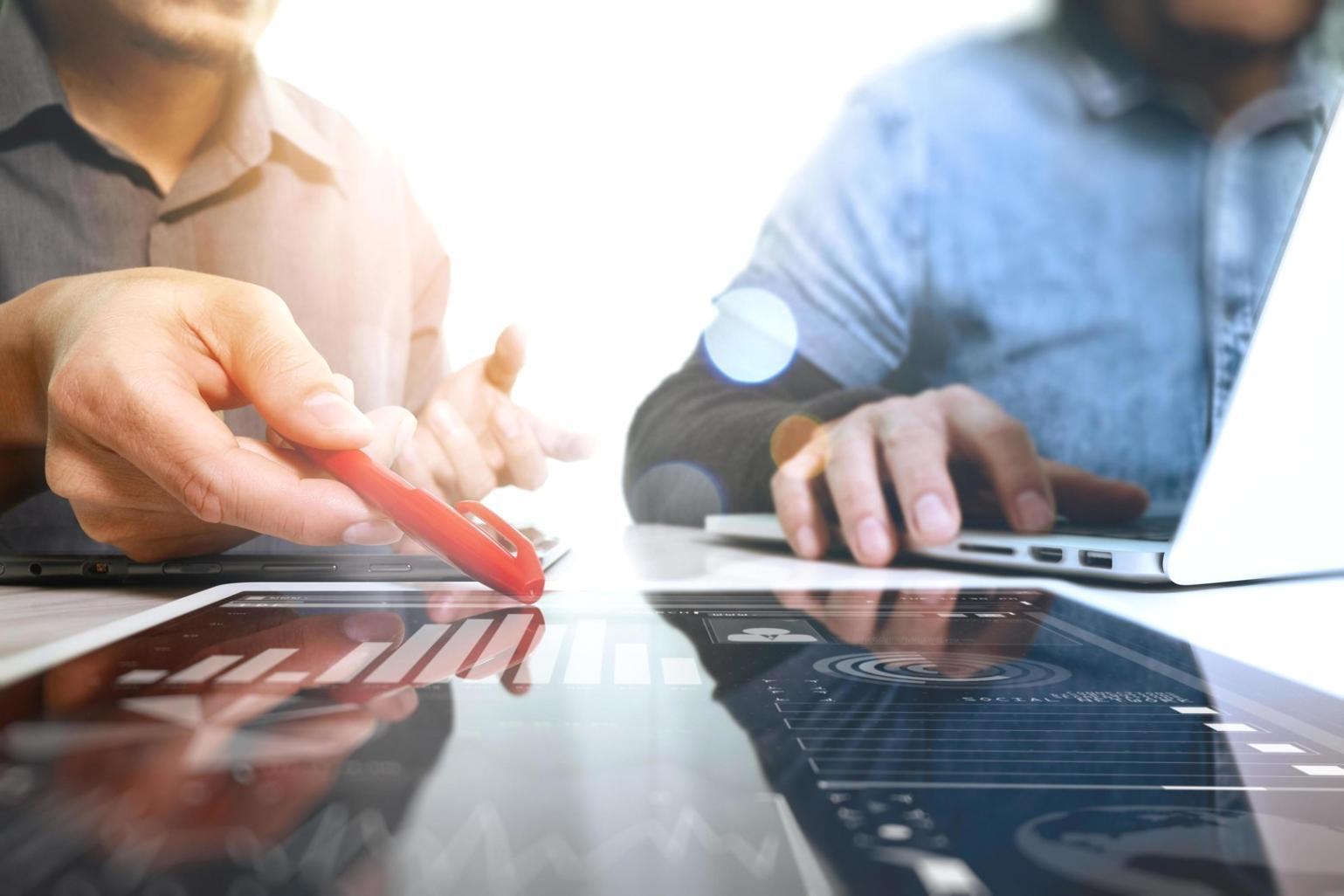 Professional testing team reviewing comprehensive test documentation and execution results